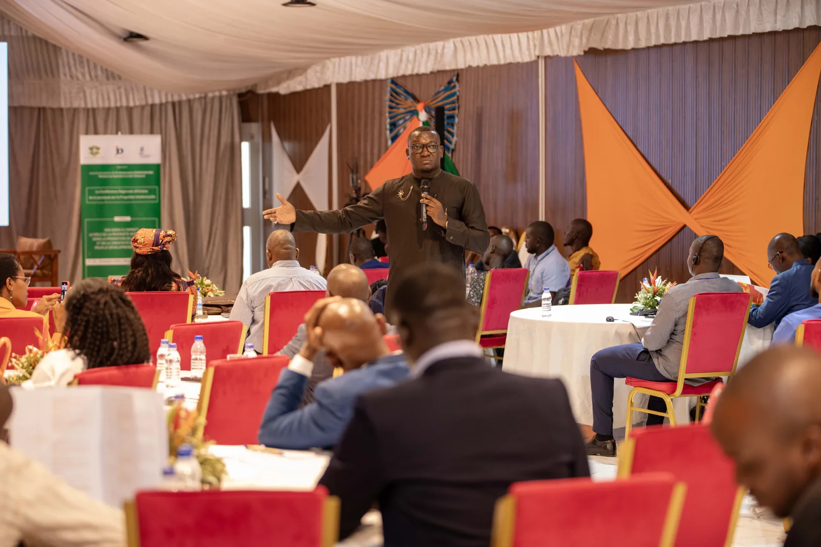 An audience facing a conference stage