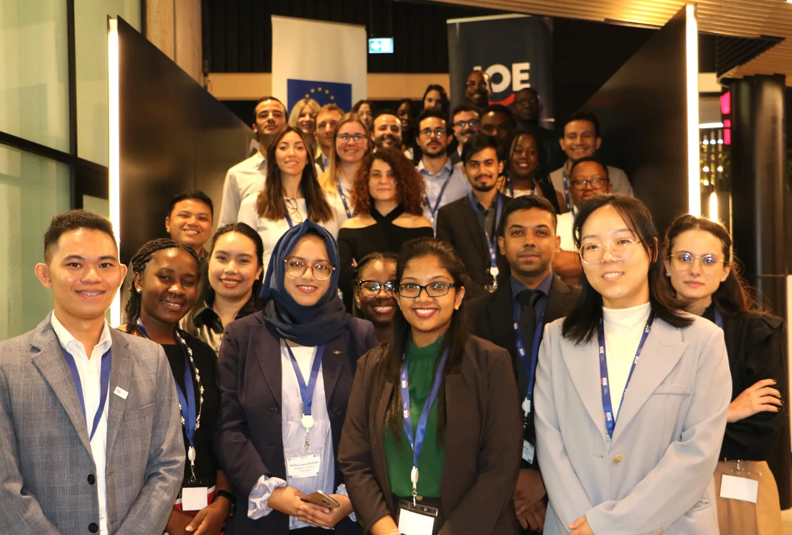 A group posing together at an indoor event