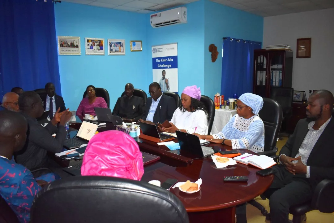 Participants seated around a meeting table
