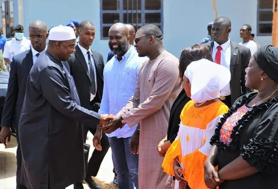 Participants greeting one another outdoors