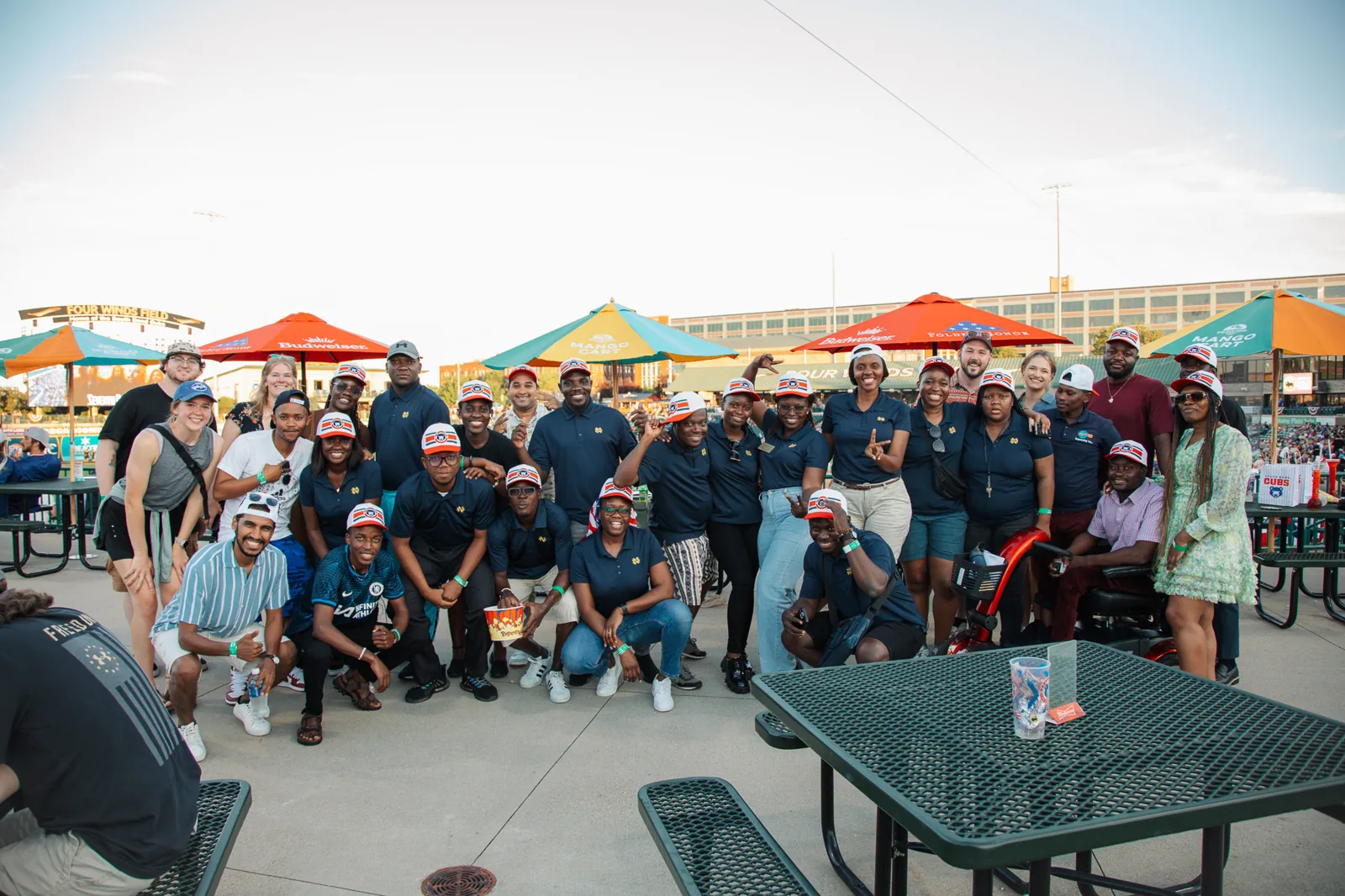 A group posing together on an outdoor terrace