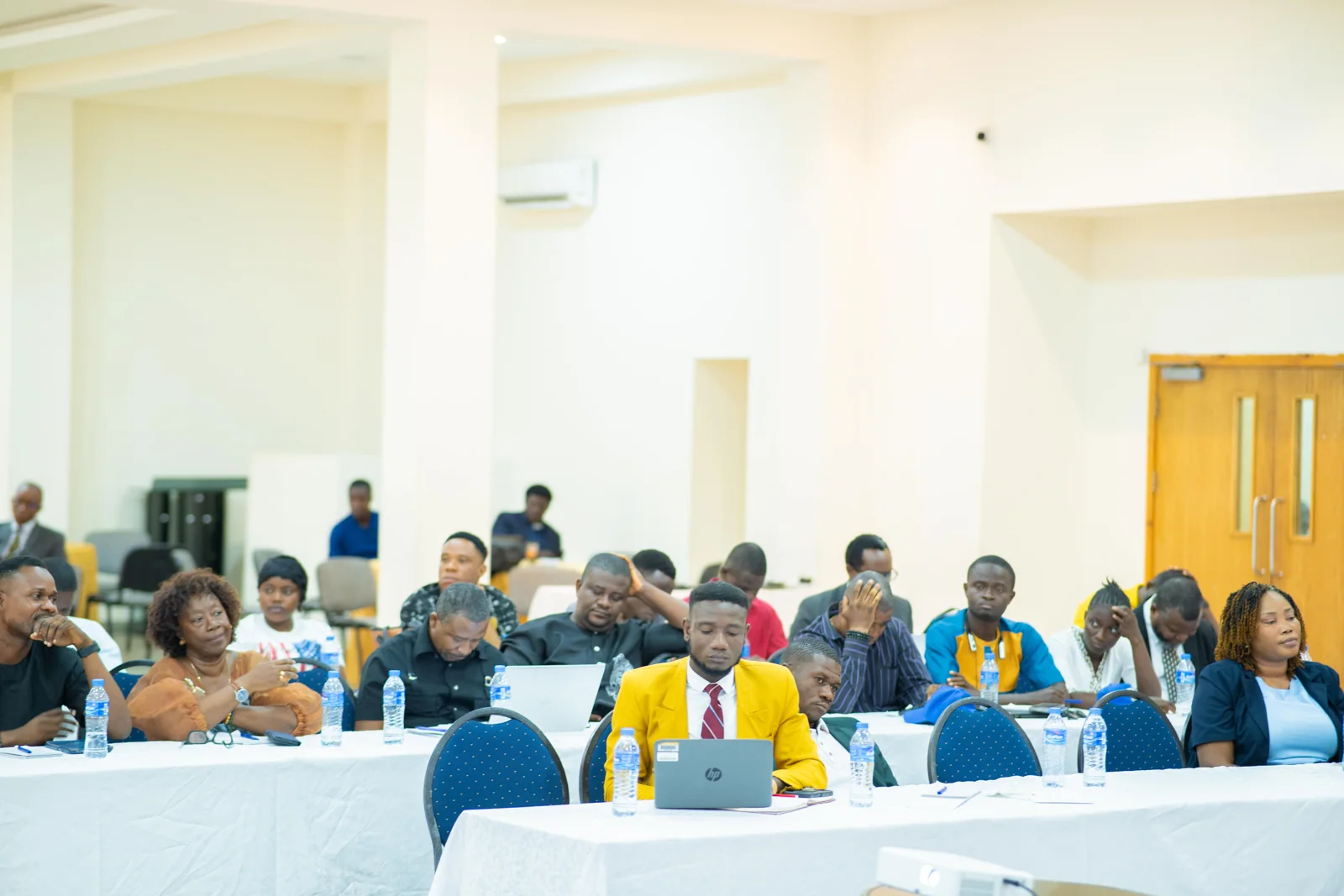 Participants gathered around the session tables