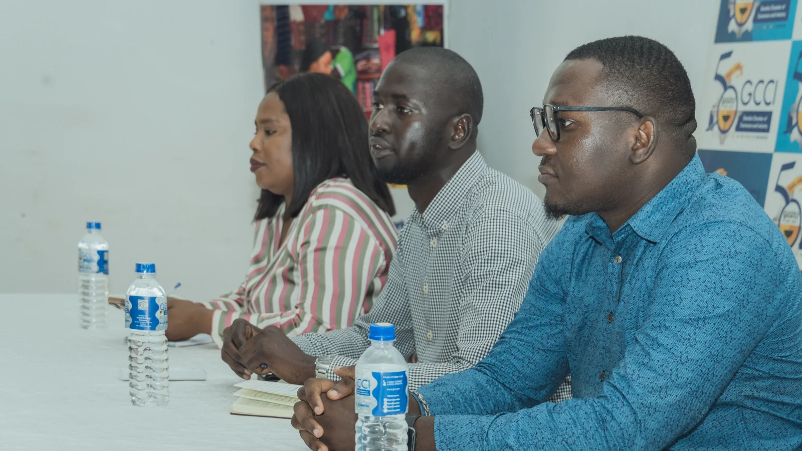 Participants seated around a meeting table