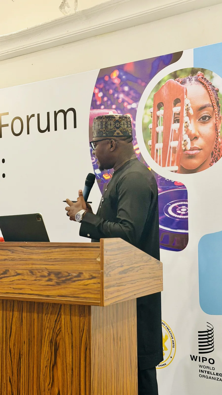 A presenter contributing from the lectern