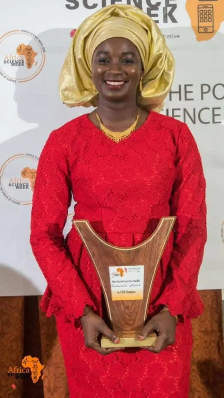A participant holding an award