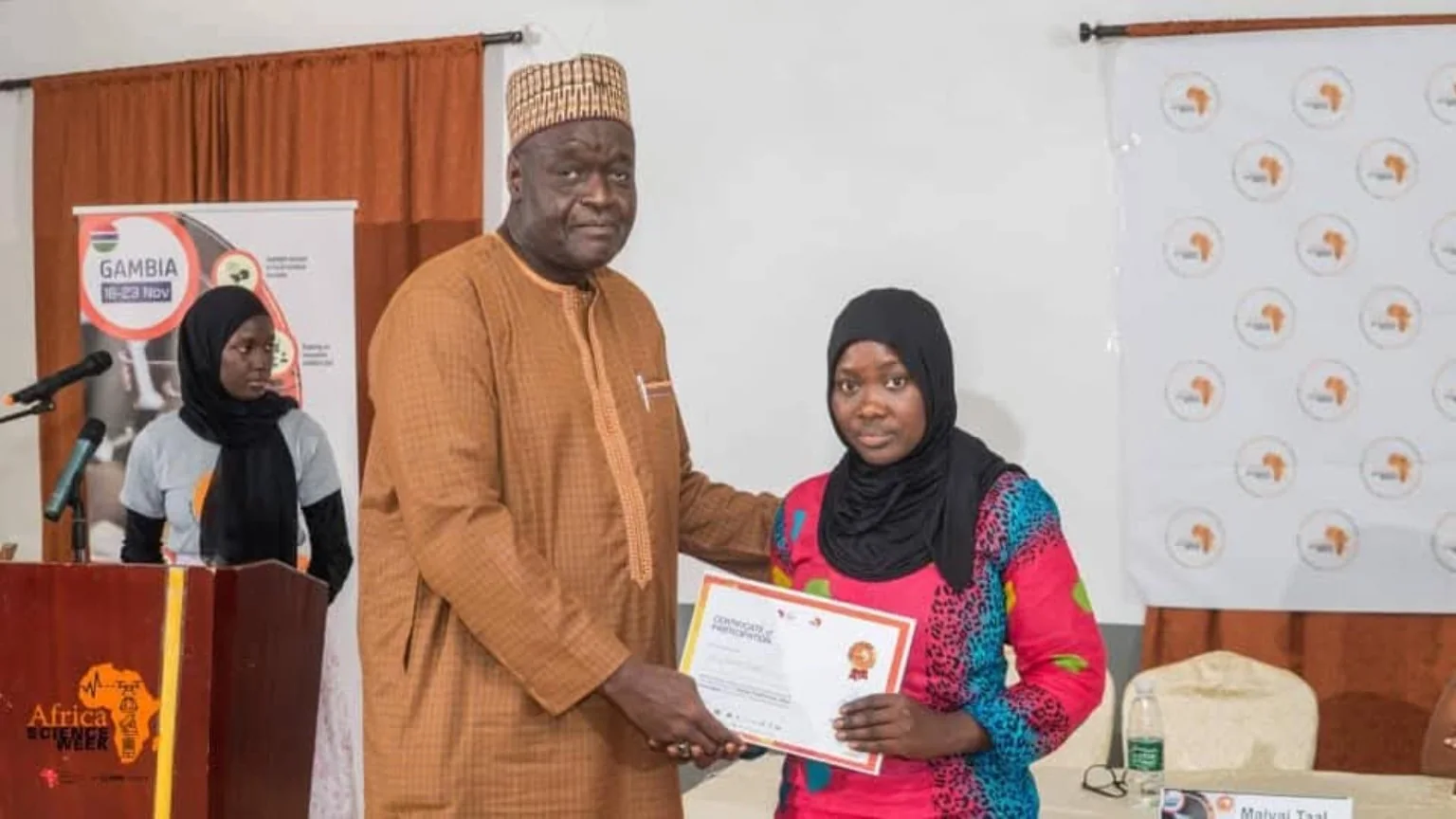 A certificate presentation at Africa Science Week