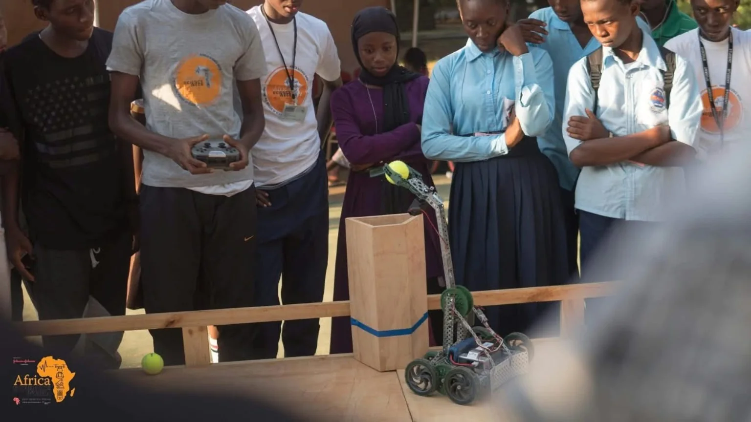 Participants looking at a wheeled prototype
